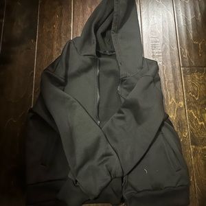 A jet black zip up hoodie from Shein. Size small. Never been worn before.